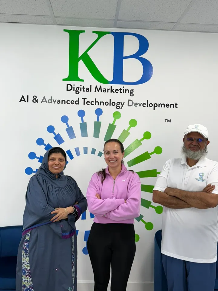 Zahra and Amir Rangwala with a client at the K Business Solutions Inc. office