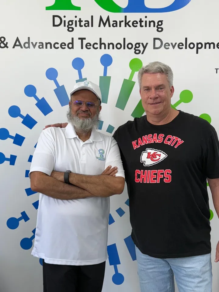 Amir Rangwala with a client at the K Business Solutions Inc. office in Cypress