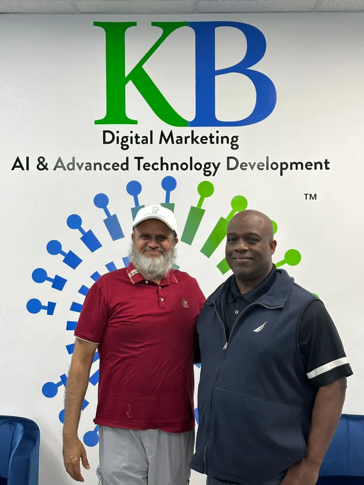 Amir Rangwala with a client at the K Business Solutions Inc. office in Cypress, Texas