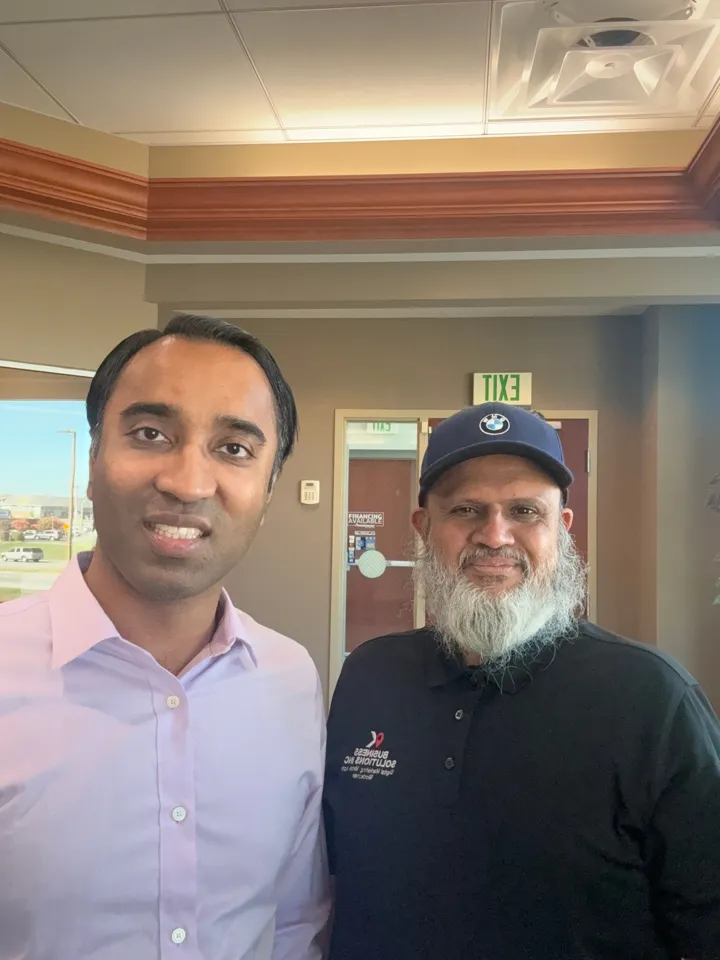 Amir Rangwala on site with a client at their business