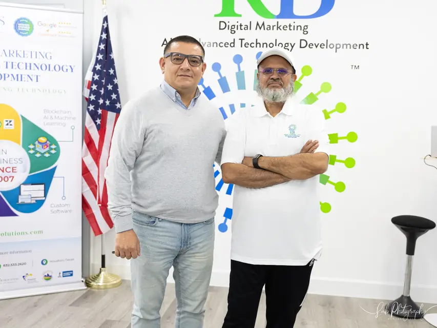 Amir Rangwala with a client at the K Business Solutions Inc. office in Cypress, Texas